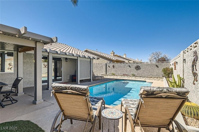 view of pool with a fenced backyard, a fenced in pool, and a patio