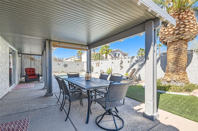 view of patio featuring outdoor dining area and a fenced backyard