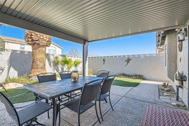 view of patio featuring outdoor dining space and a fenced backyard