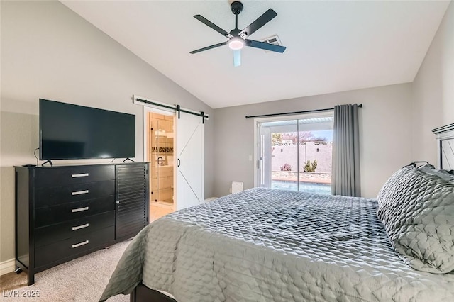 bedroom featuring light carpet, a barn door, connected bathroom, access to exterior, and vaulted ceiling