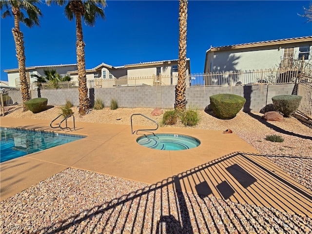 view of swimming pool with a fenced in pool, a fenced backyard, a patio, and an in ground hot tub