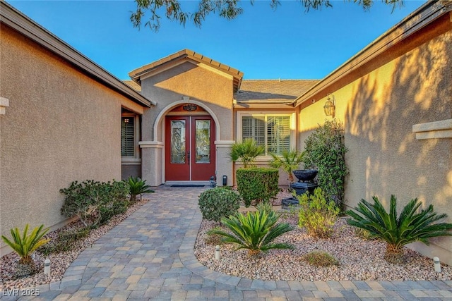 doorway to property with stucco siding