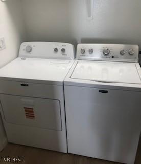 washroom featuring laundry area and washer and dryer