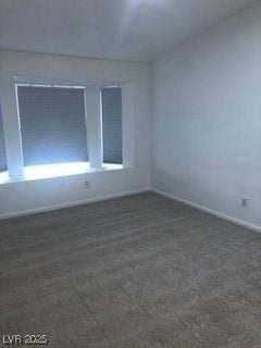 unfurnished room with concrete flooring