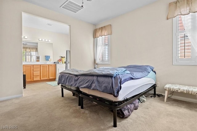 bedroom featuring multiple windows, visible vents, and light colored carpet