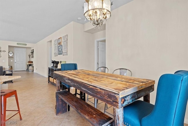 dining space featuring a chandelier and light tile patterned floors