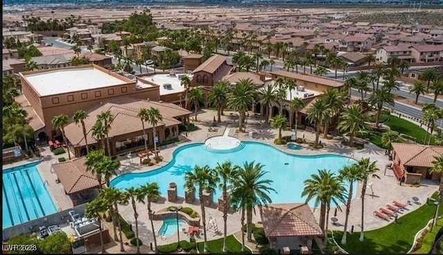 view of swimming pool featuring a residential view