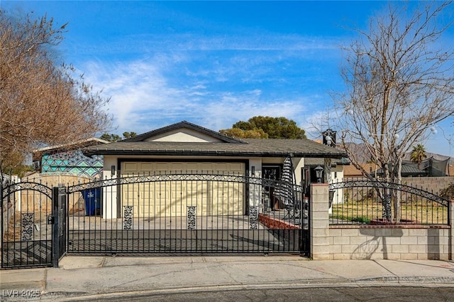 view of gate with a fenced front yard