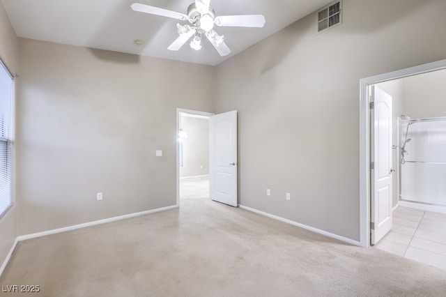 unfurnished bedroom with a ceiling fan, carpet, visible vents, and baseboards