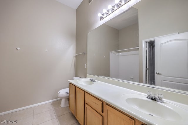 full bath with double vanity, tile patterned flooring, a sink, and toilet