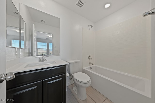 full bath with toilet, bathing tub / shower combination, vanity, and visible vents