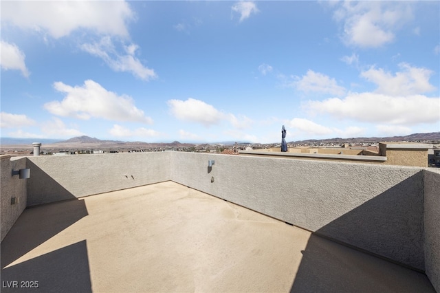 view of patio / terrace featuring a mountain view