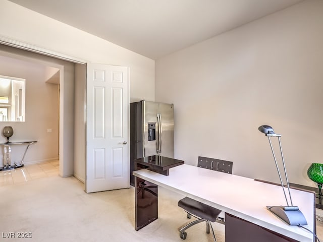 office featuring light carpet and vaulted ceiling