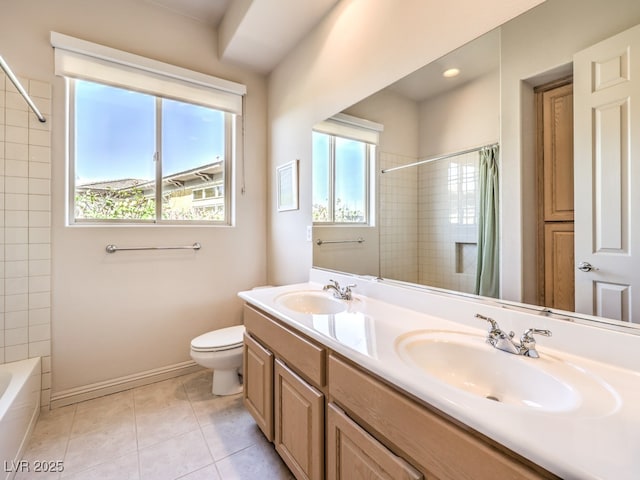 full bathroom with tile patterned floors, plenty of natural light, and a sink