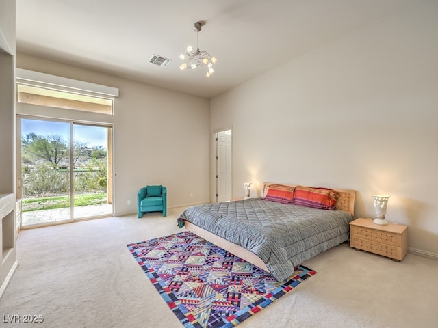 carpeted bedroom with access to exterior, visible vents, baseboards, and an inviting chandelier