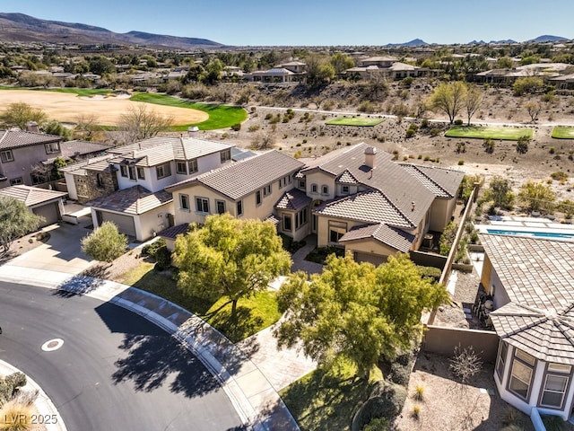 birds eye view of property with a mountain view and a residential view
