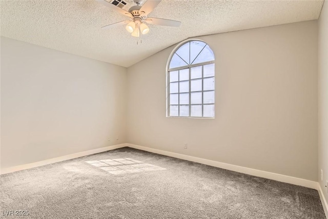 unfurnished room featuring ceiling fan, a textured ceiling, carpet flooring, and baseboards