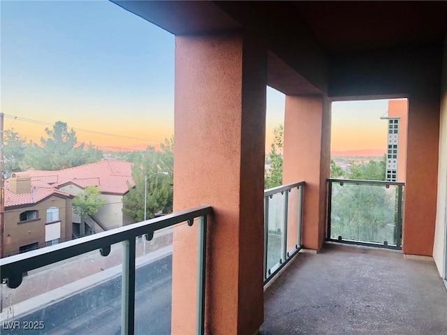 view of balcony at dusk