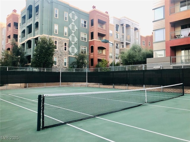 view of sport court with fence