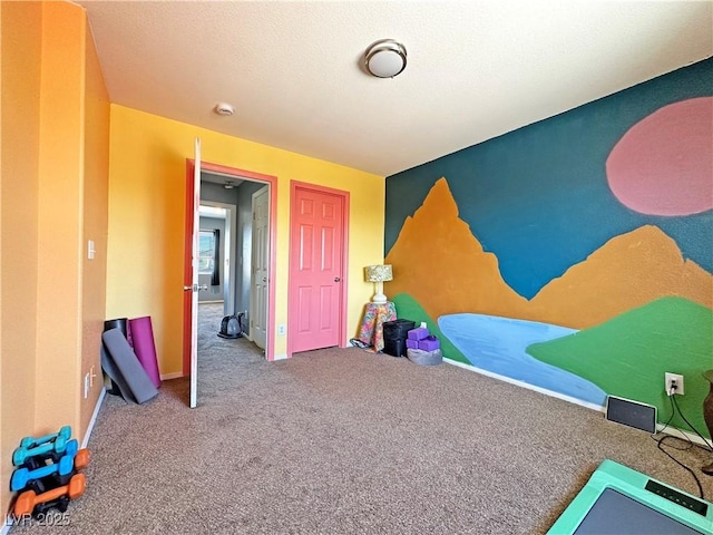 game room with carpet and baseboards