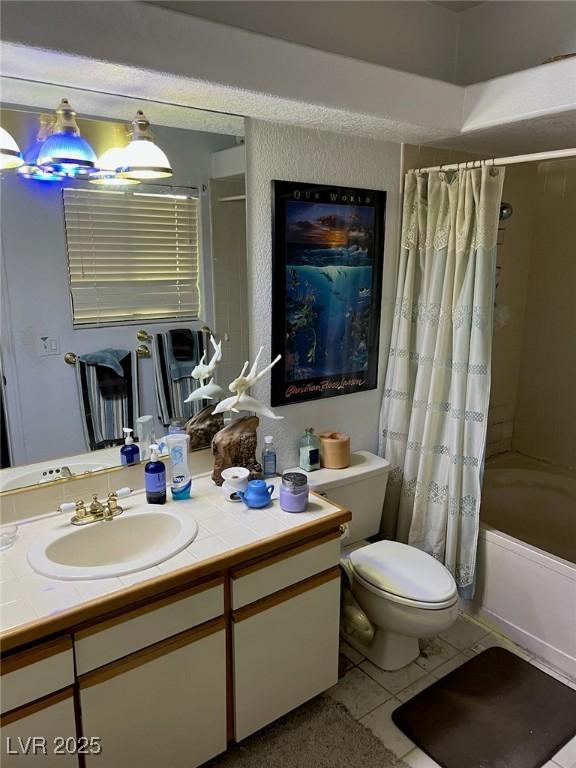 bathroom with toilet, tile patterned flooring, shower / bath combination with curtain, and vanity