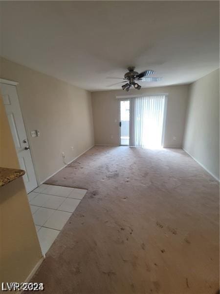 empty room with light carpet and ceiling fan