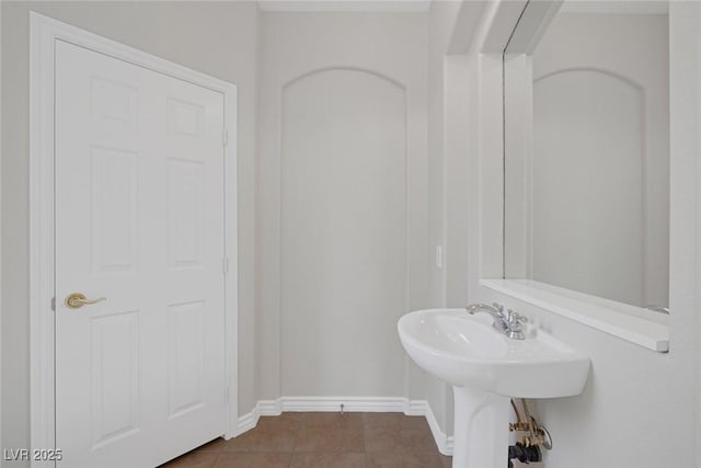 bathroom with tile patterned flooring and baseboards