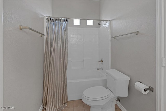 full bath featuring shower / tub combo with curtain, toilet, and tile patterned floors