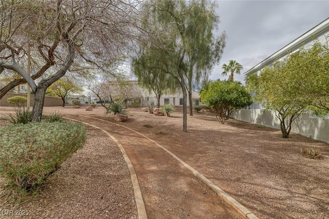 view of property's community with fence