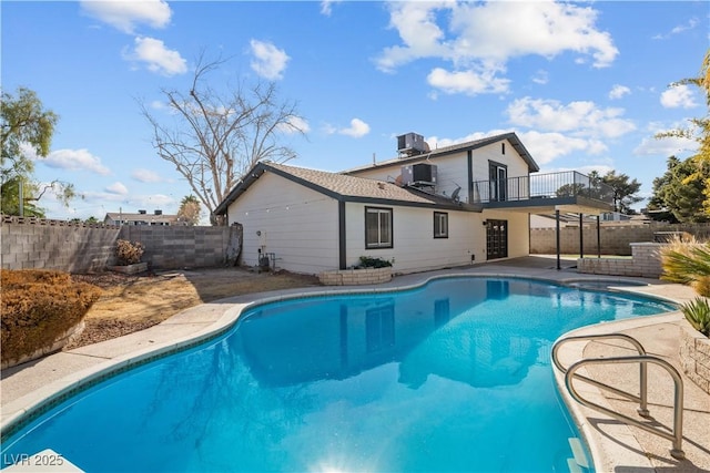 view of pool with a patio area, a fenced backyard, cooling unit, and a fenced in pool