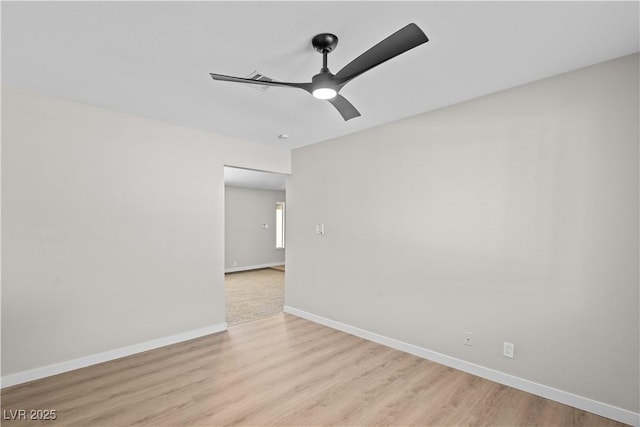 unfurnished room featuring light wood-style floors, baseboards, and a ceiling fan