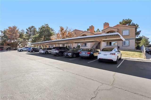 view of partially covered parking lot