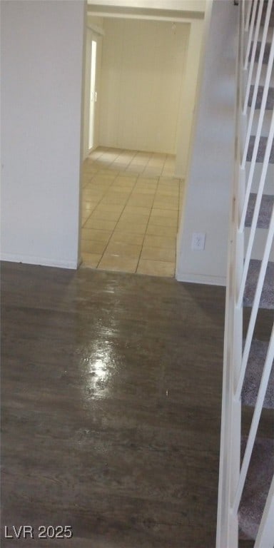 corridor with wood finished floors and stairs