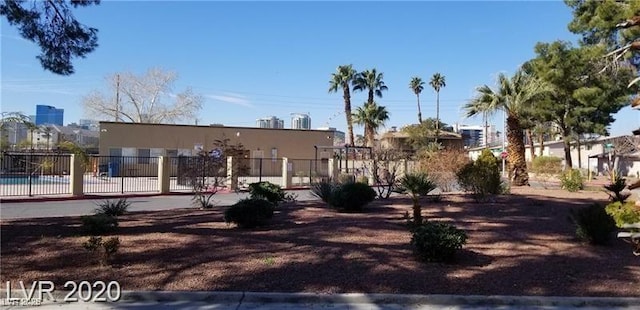 view of home's community with fence