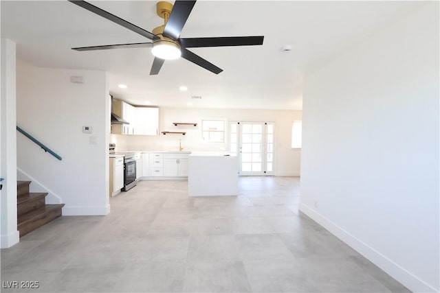 unfurnished living room featuring ceiling fan, stairway, recessed lighting, and baseboards