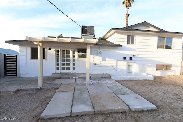 back of property featuring a patio and central air condition unit