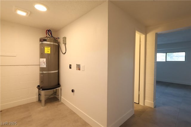 utility room featuring water heater