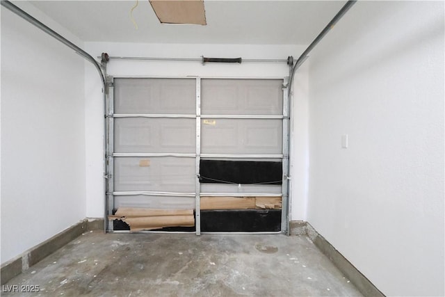 garage featuring baseboards