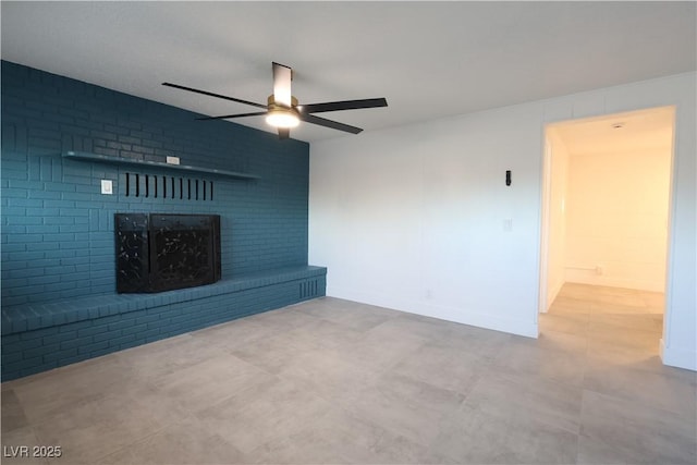 unfurnished living room with ceiling fan and a fireplace