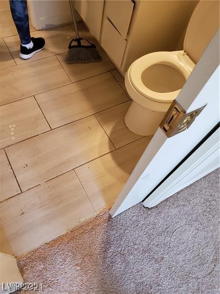 bathroom featuring toilet and tile patterned floors