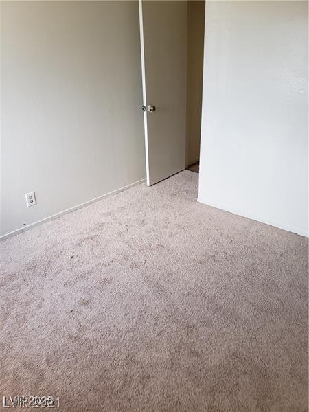 empty room featuring light colored carpet