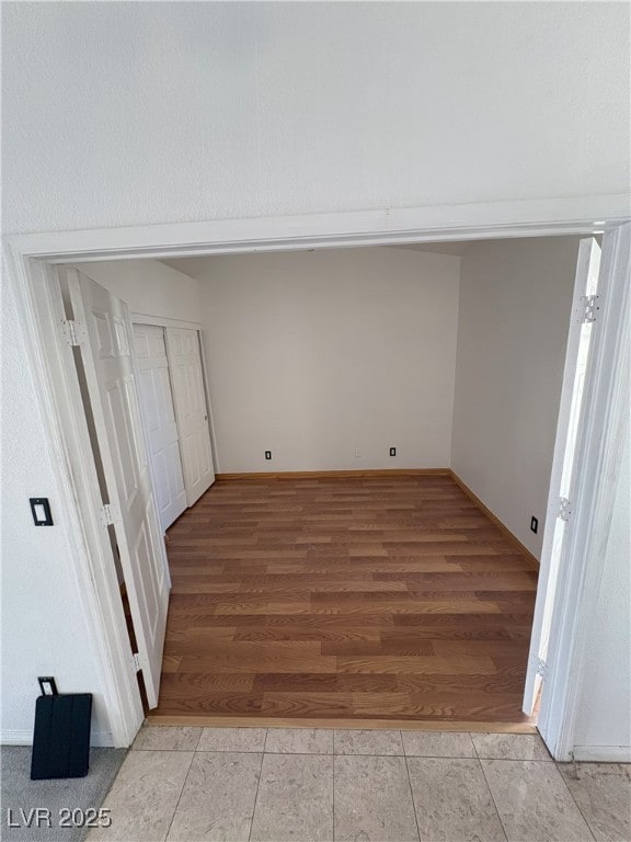 interior space with light wood-style floors and baseboards