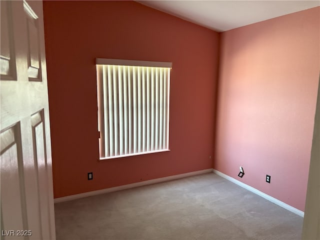 carpeted empty room with baseboards