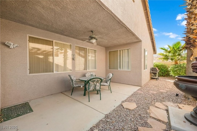 view of patio / terrace featuring a ceiling fan and outdoor dining area