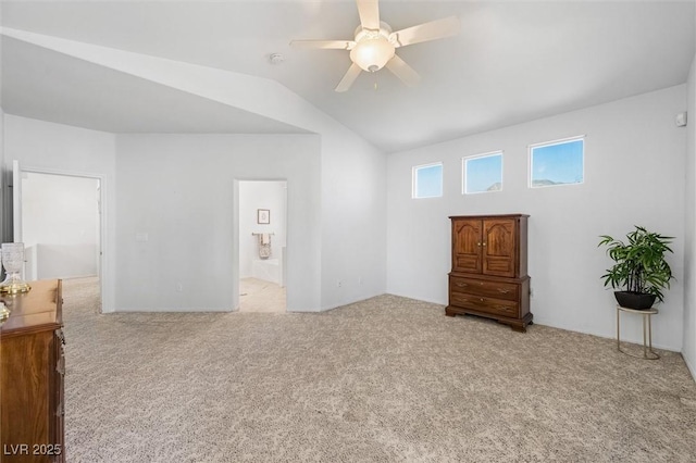 bedroom featuring carpet floors, lofted ceiling, and a ceiling fan