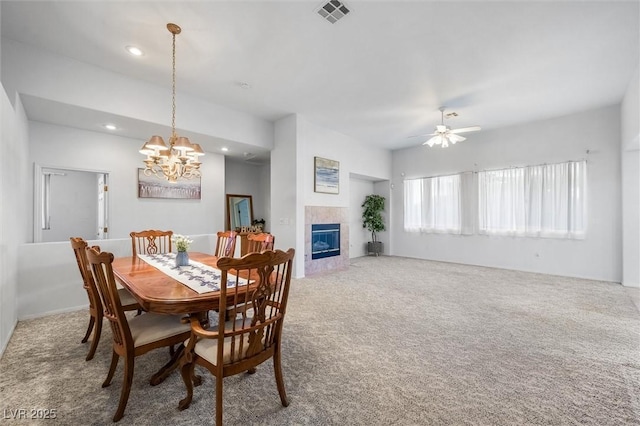 carpeted dining room with recessed lighting, visible vents, a fireplace, and ceiling fan