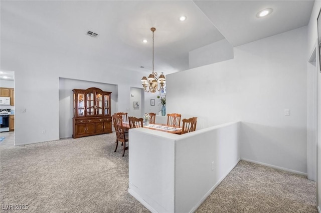 dining space with recessed lighting, visible vents, a notable chandelier, and light colored carpet