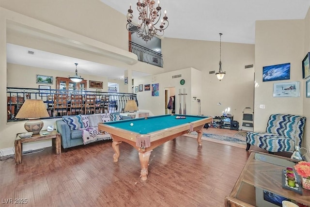 recreation room with visible vents, high vaulted ceiling, wood finished floors, and billiards