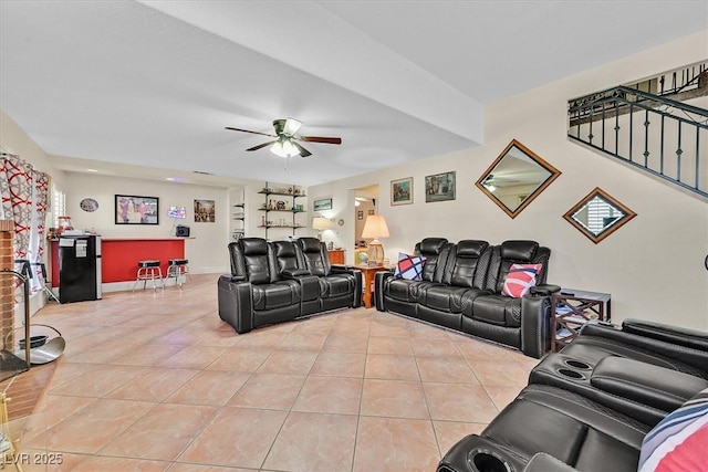 living room featuring light tile patterned flooring and ceiling fan