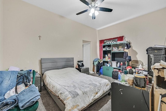 bedroom with a ceiling fan and carpet floors